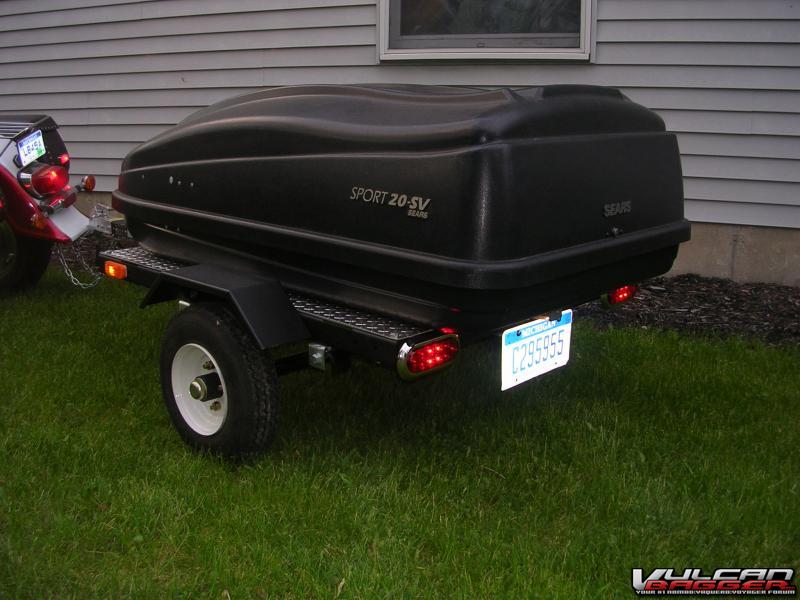 My cheap-o trailer made from a harbor freight kit and a cartop carrier. It towed perfectly.